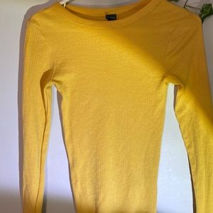 This is a yellow long sleeve shirt, it can be worn as a body suit also.